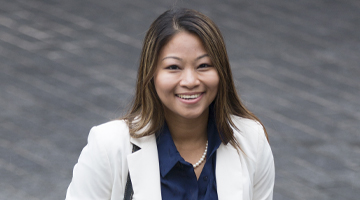 Young woman in work suit smiling for camera