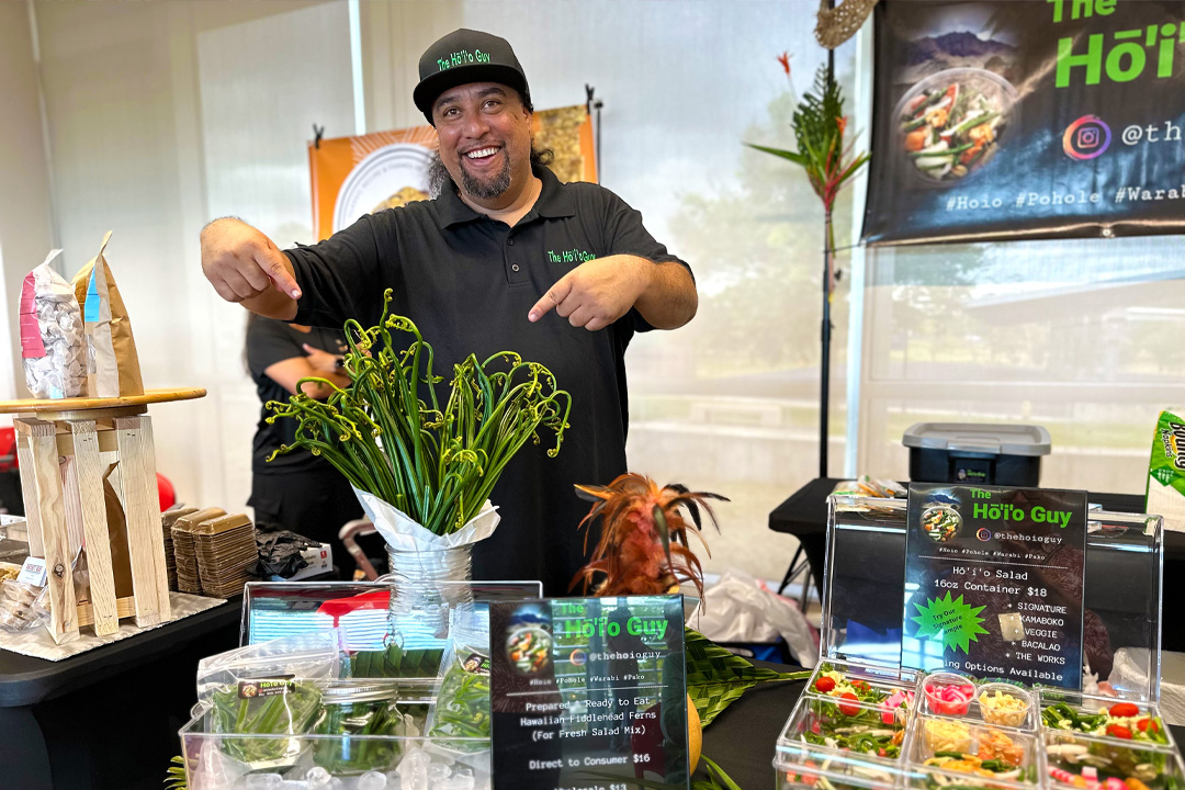 Local food entrepreneur showcasing product at Leeward CC showcase