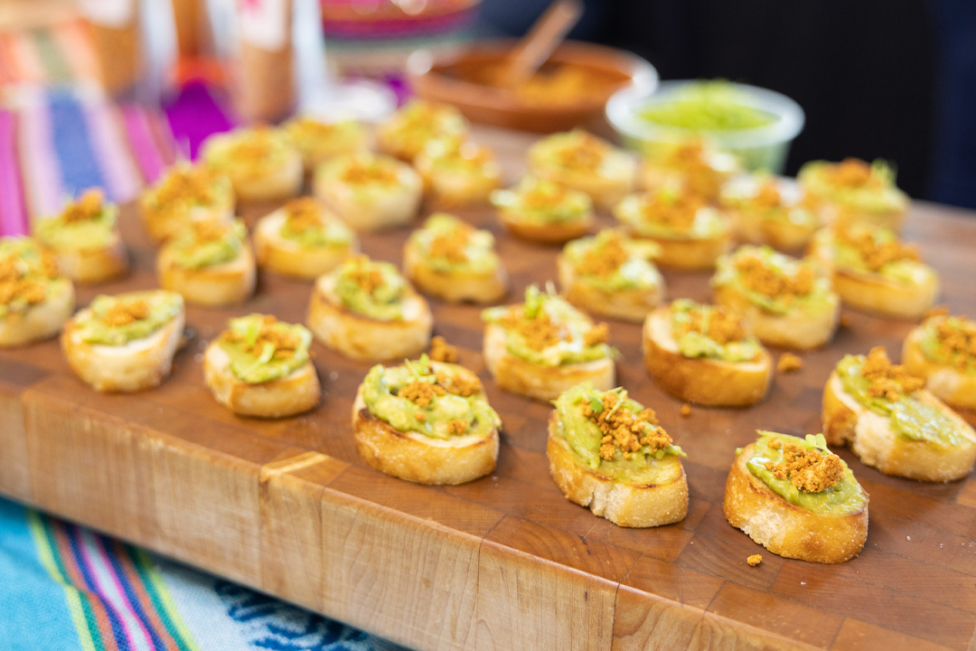 Closeup of avocado toast pieces on wooden board