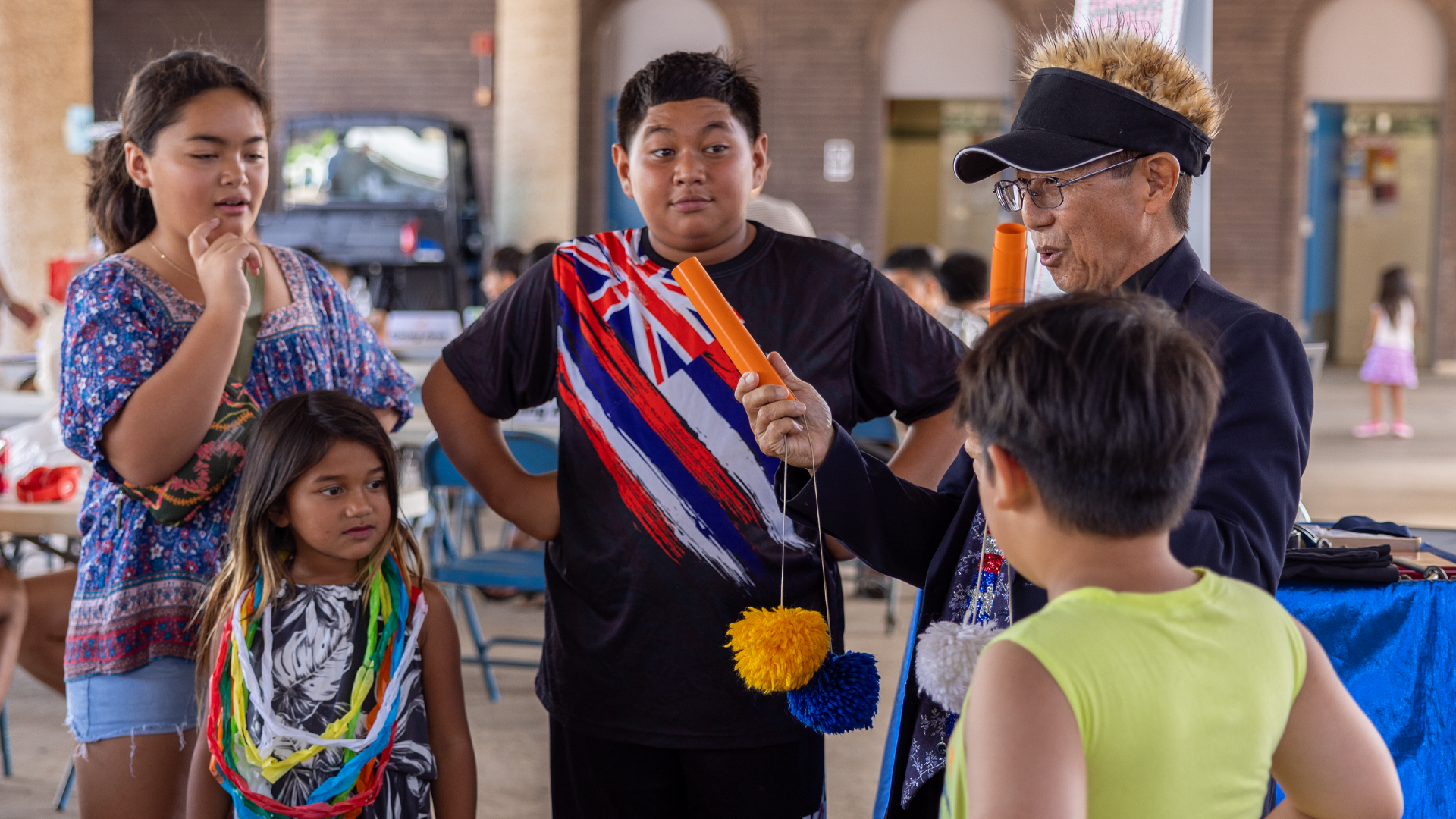 Harvey the Magician performing tricks for keiki